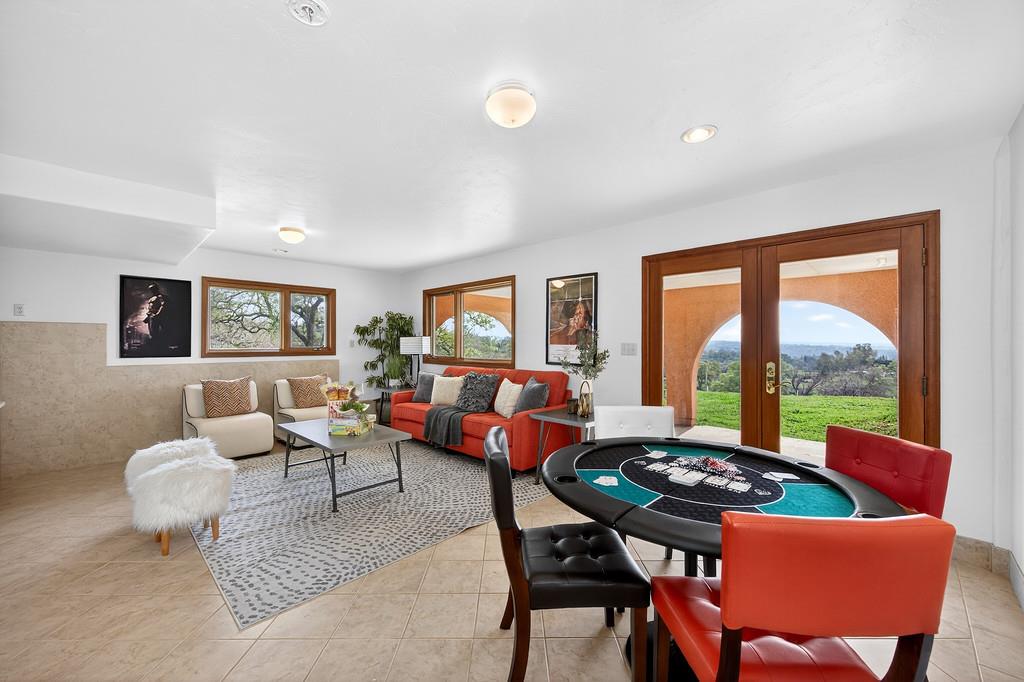 7730 McCourtney Road Lincoln, CA 95648 - Photo 48 of 99 a living room with furniture and a floor to ceiling window
