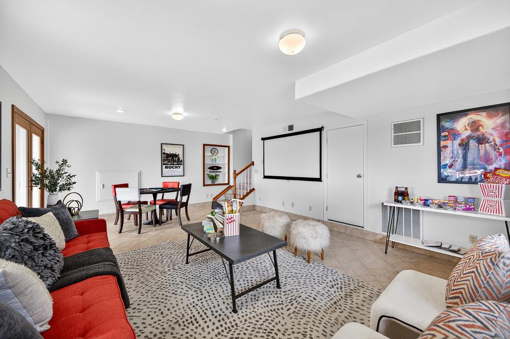 7730 McCourtney Road Lincoln, CA 95648 - Photo 52 of 99 a living room with furniture and a flat screen tv