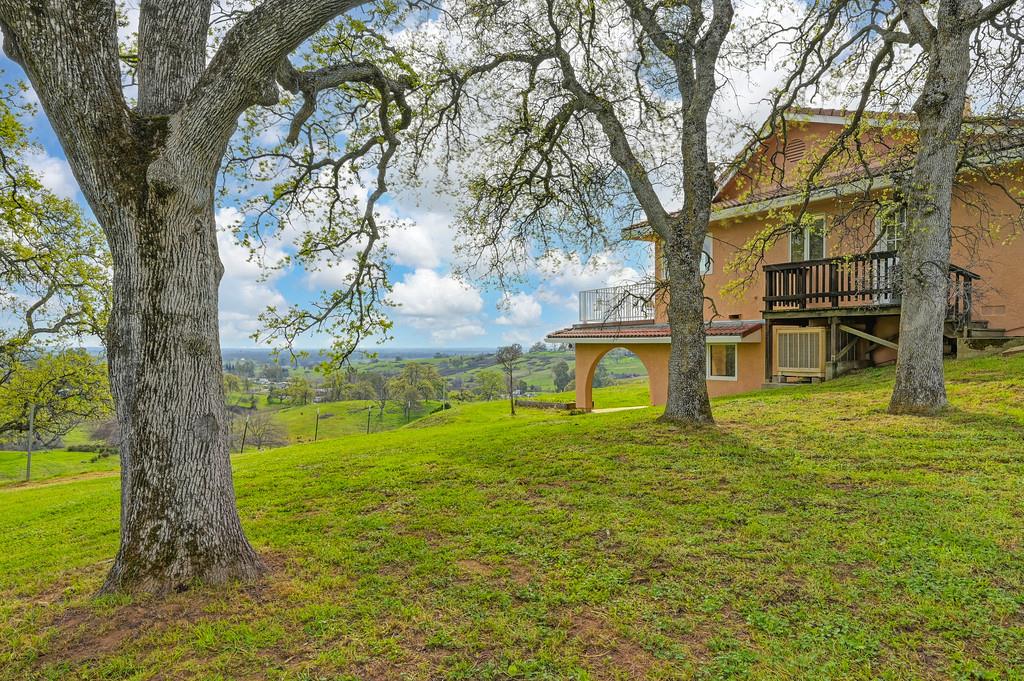 7730 McCourtney Road Lincoln, CA 95648 - Photo 55 of 99 a backyard of a house with lots of green space and fountain