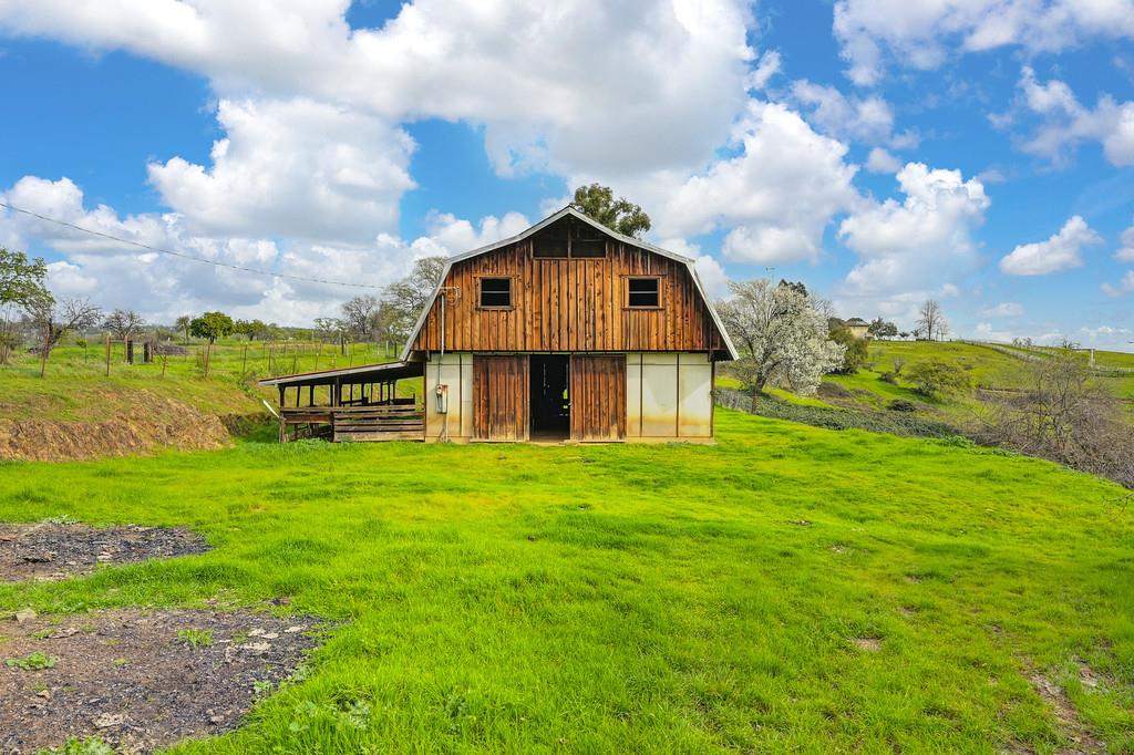 7730 McCourtney Road Lincoln, CA 95648 - Photo 59 of 99 a view of a big house with a big yard and large trees