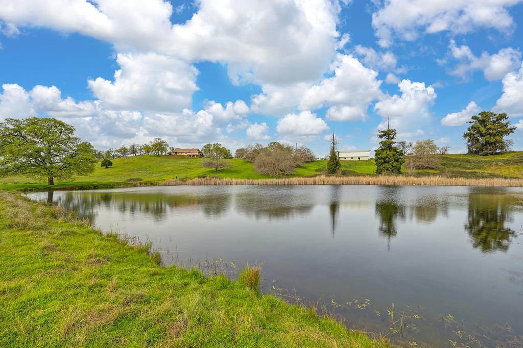 7730 McCourtney Road Lincoln, CA 95648 - Photo 80 of 99 a view of a lake with a yard