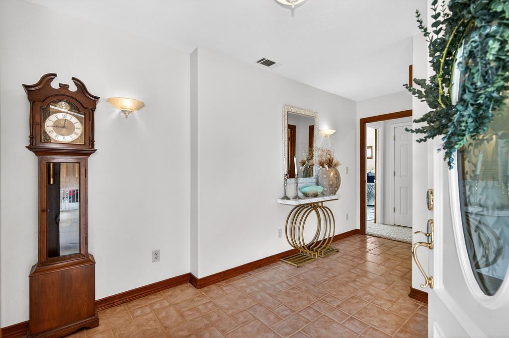 7730 McCourtney Road Lincoln, CA 95648 - Photo 9 of 99 a view of livingroom with furniture and a chandelier