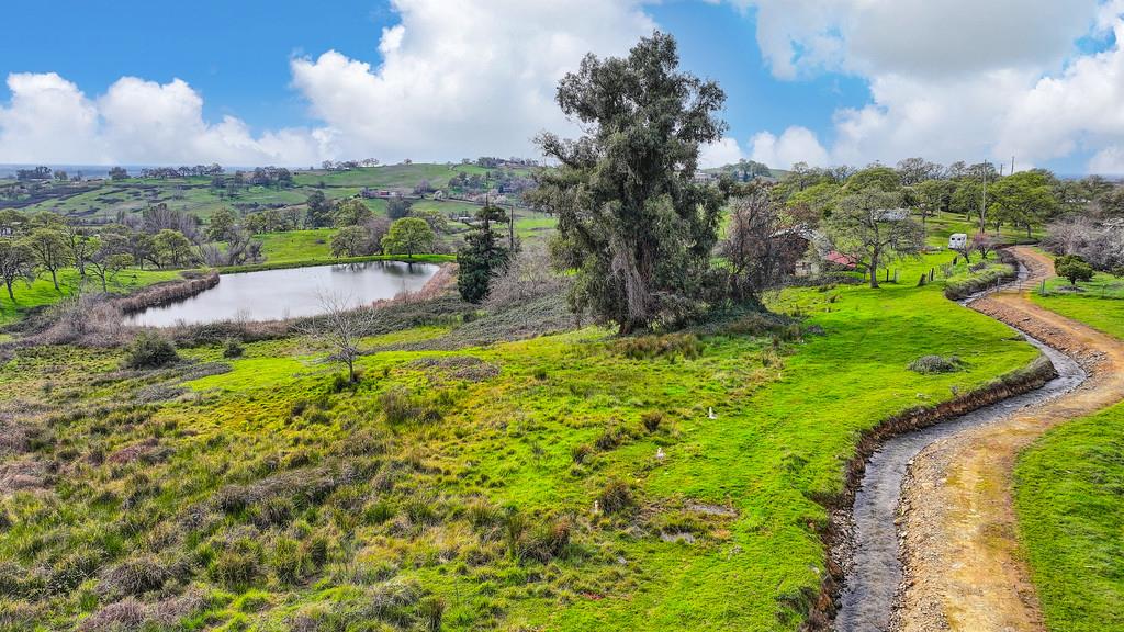 7730 McCourtney Road Lincoln, CA 95648 - Photo 91 of 99 a view of a lake with a yard