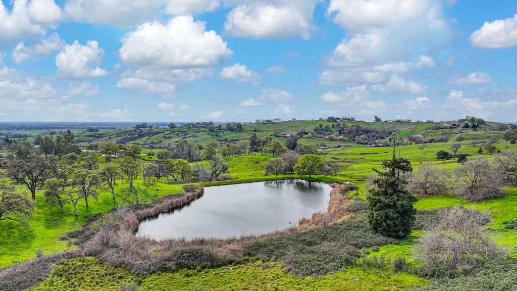 7730 McCourtney Road Lincoln, CA 95648 - Photo 92 of 99 a view of a lake with a big yard