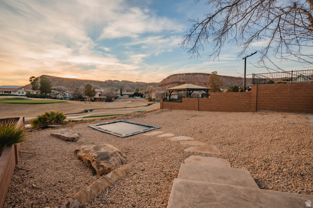 980 Cactus Circle St. George, UT 84790 - Photo 55 of 77 View of yard with a gazebo, a mountain view, and a residential view