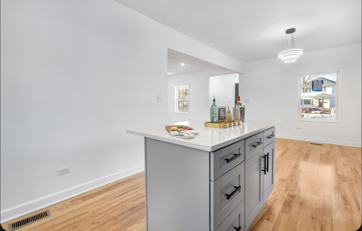 419 Cleveland Street Gary, IN 46404 - Photo 11 of 42 a bathroom with a sink a mirror and a bathtub