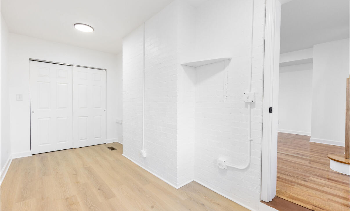419 Cleveland Street Gary, IN 46404 - Photo 16 of 42 a view of a room with wooden floor