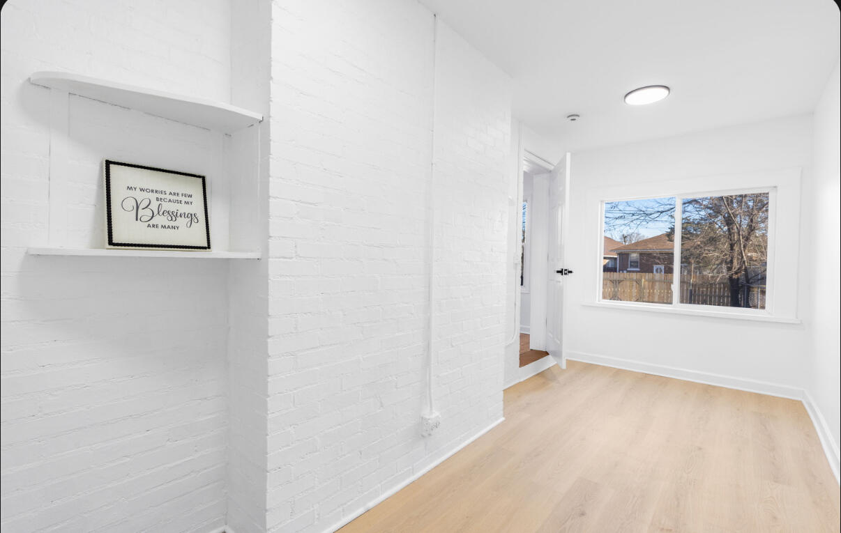 419 Cleveland Street Gary, IN 46404 - Photo 17 of 42 a view of an empty room with a window