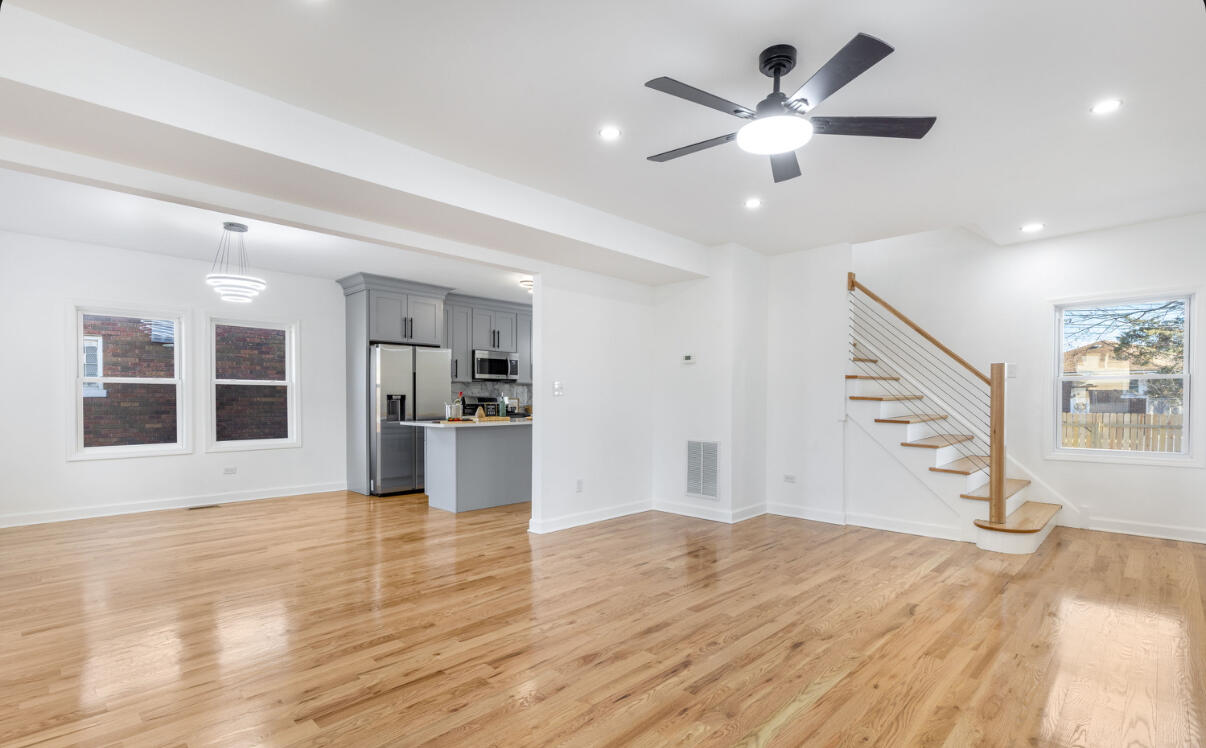 419 Cleveland Street Gary, IN 46404 - Photo 18 of 42 a view of an empty room with window and wooden floor
