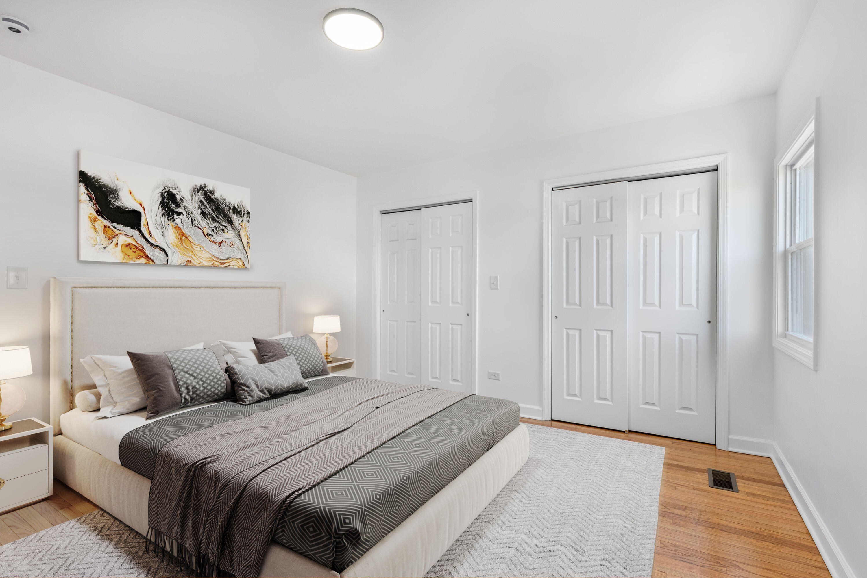 419 Cleveland Street Gary, IN 46404 - Photo 19 of 42 a bedroom with a bed and a painting on the wall