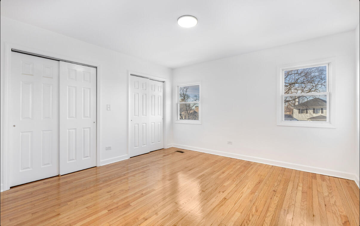 419 Cleveland Street Gary, IN 46404 - Photo 21 of 42 a view of an empty room with wooden floor