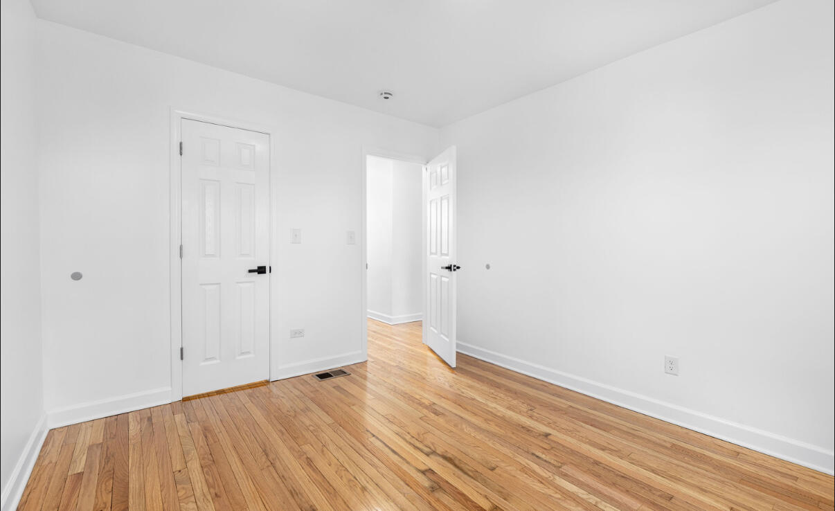 419 Cleveland Street Gary, IN 46404 - Photo 25 of 42 a view of room with wooden floor