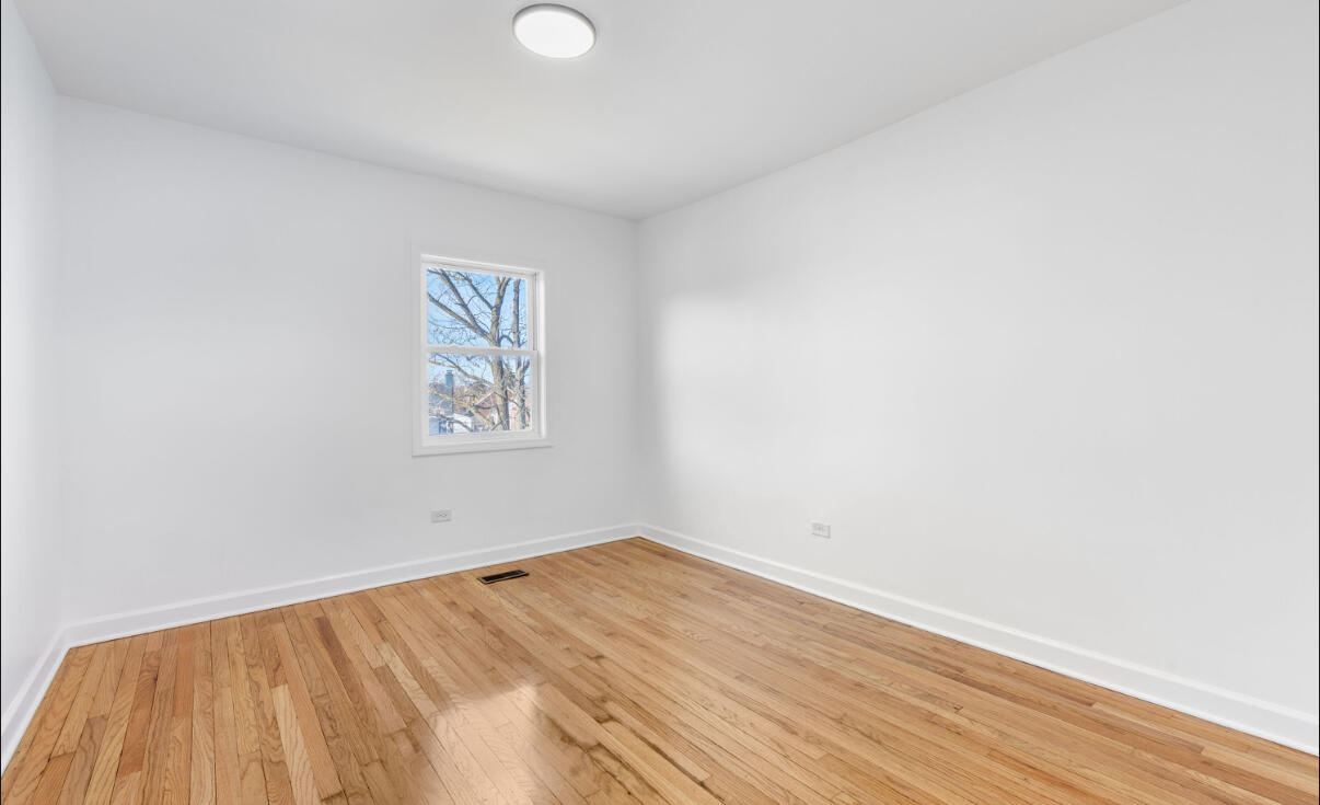 419 Cleveland Street Gary, IN 46404 - Photo 27 of 42 a view of empty room with wooden floor