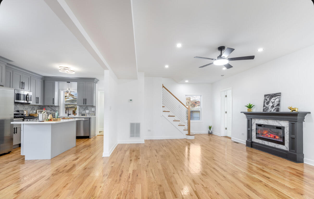 419 Cleveland Street Gary, IN 46404 - Photo 3 of 42 a view of kitchen and kitchen with furniture wooden floor and window