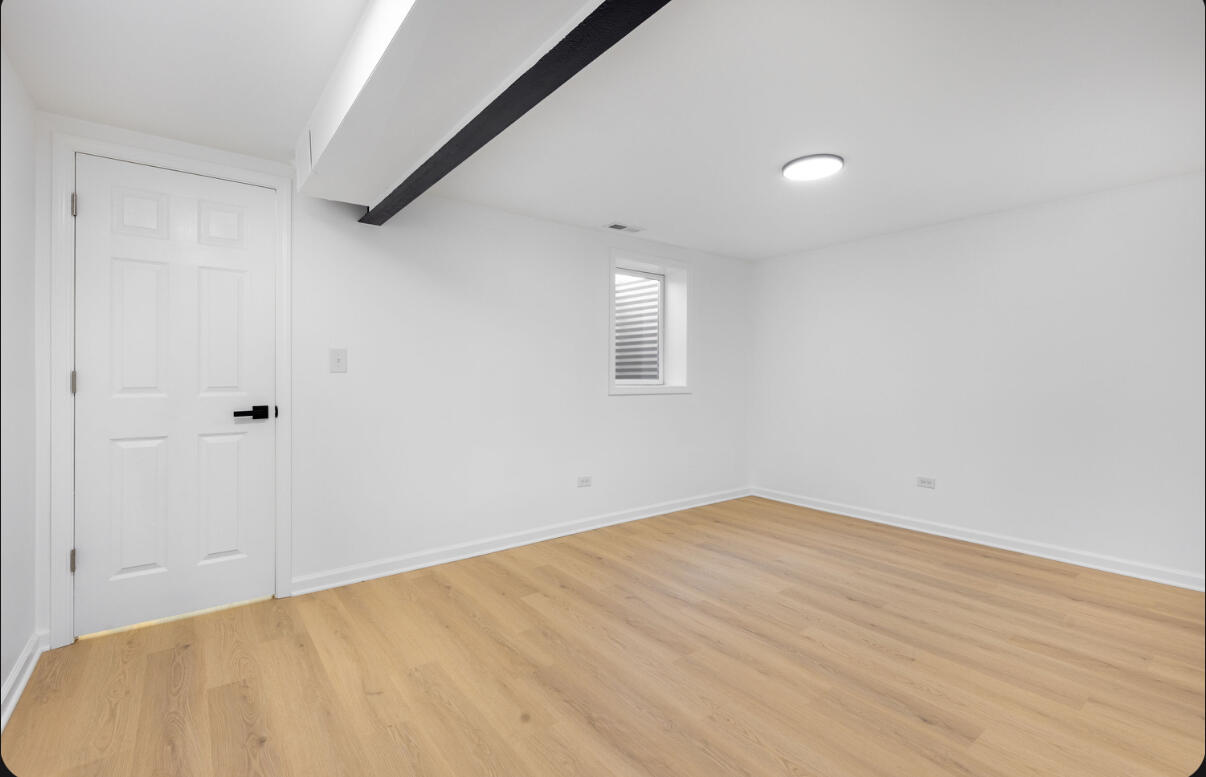 419 Cleveland Street Gary, IN 46404 - Photo 33 of 42 a view of empty room with wooden floor