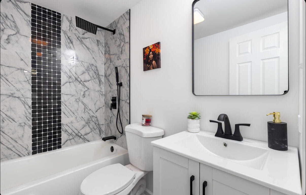 419 Cleveland Street Gary, IN 46404 - Photo 35 of 42 a bathroom with a sink toilet and shower