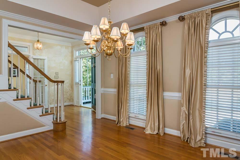 7525 Hazelhurst Circle Apex, NC 27502 - Photo 12 of 25 a view of a hallway with wooden floor and staircase