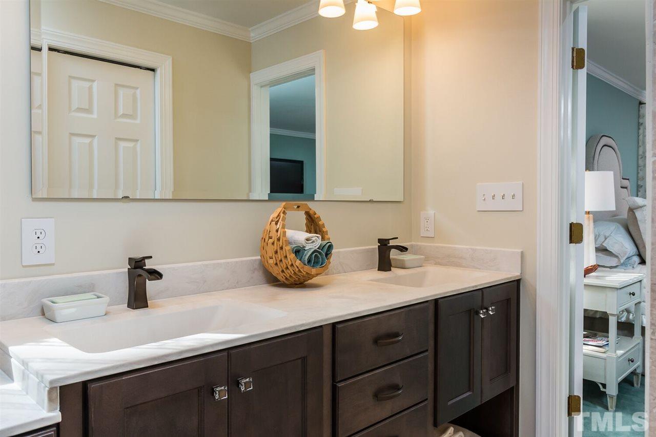 7525 Hazelhurst Circle Apex, NC 27502 - Photo 15 of 25 a bathroom with a sink and a mirror