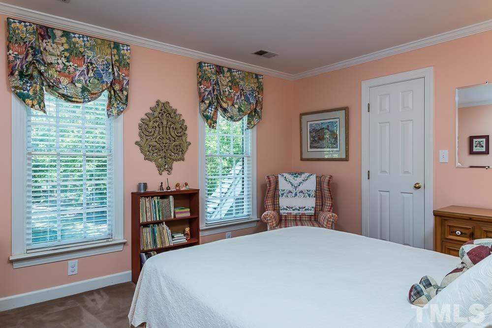 7525 Hazelhurst Circle Apex, NC 27502 - Photo 18 of 25 a bedroom with a bed and a window