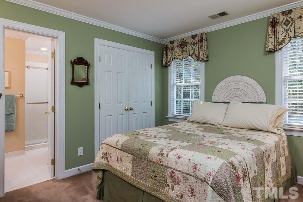 7525 Hazelhurst Circle Apex, NC 27502 - Photo 20 of 25 a bedroom with a bed and a painting