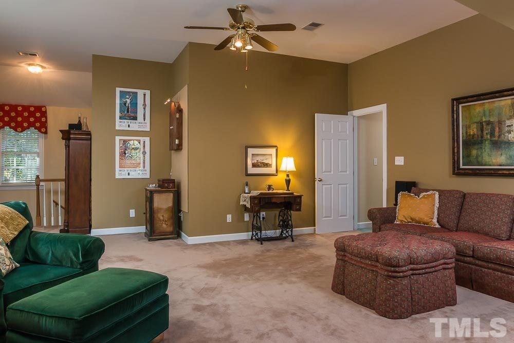 7525 Hazelhurst Circle Apex, NC 27502 - Photo 22 of 25 a living room with furniture and a couch