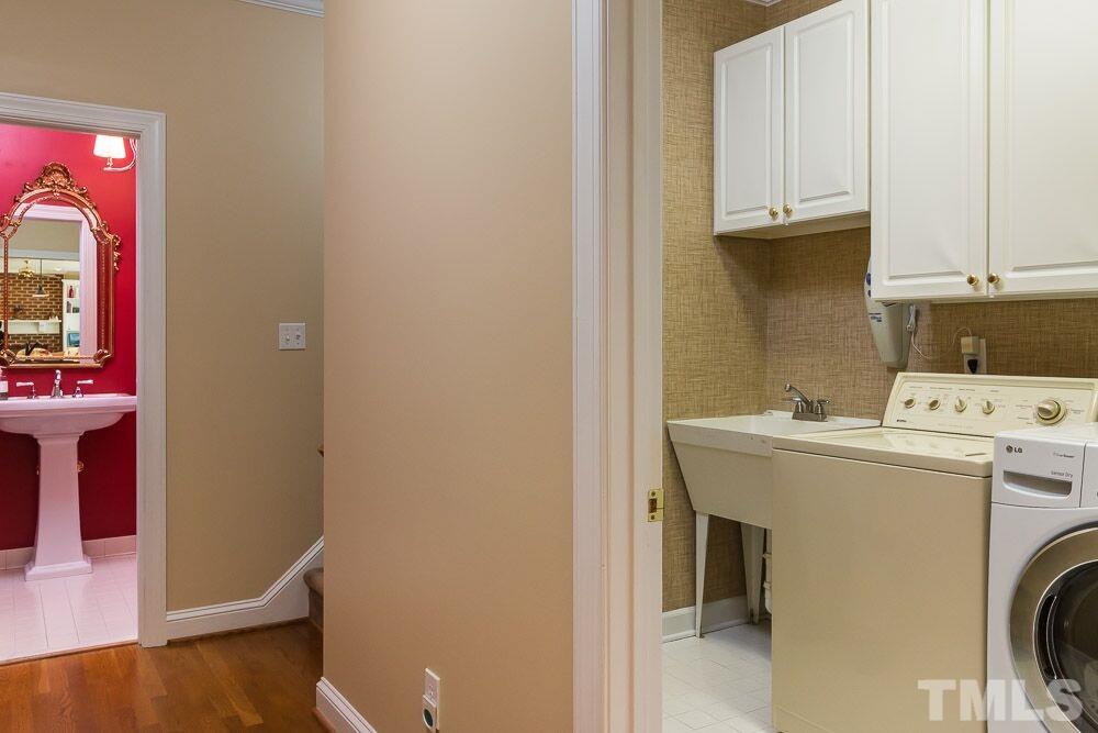 7525 Hazelhurst Circle Apex, NC 27502 - Photo 23 of 25 a utility room with dryer and washer