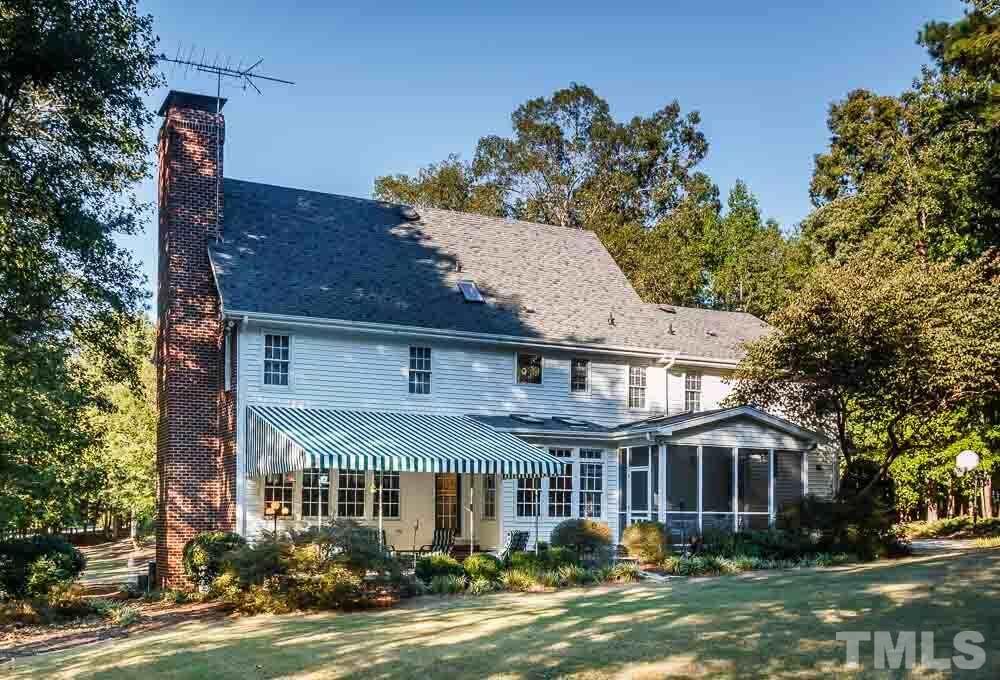 7525 Hazelhurst Circle Apex, NC 27502 - Photo 25 of 25 a front view of a house with a garden and trees