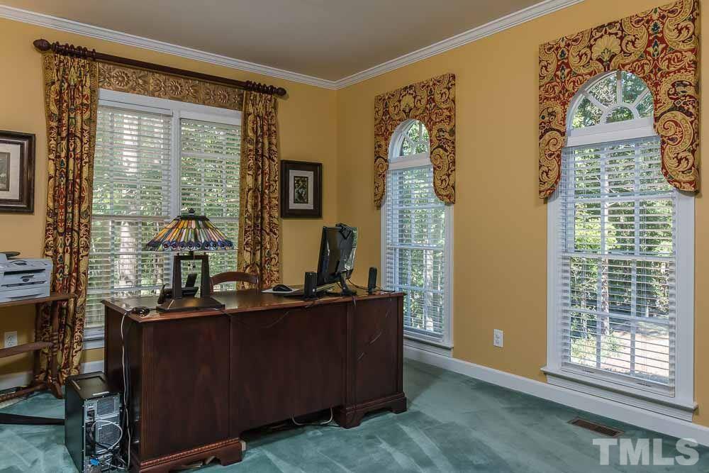 7525 Hazelhurst Circle Apex, NC 27502 - Photo 5 of 25 a room with a large window and bed