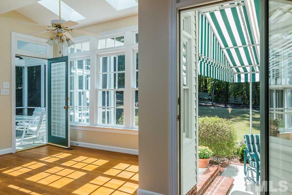 7525 Hazelhurst Circle Apex, NC 27502 - Photo 8 of 25 a view of a porch with a floor to ceiling window