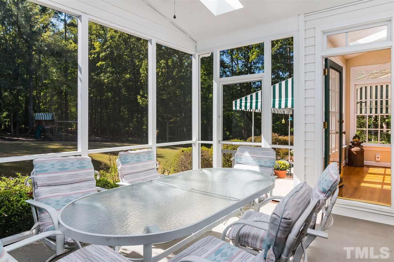 7525 Hazelhurst Circle Apex, NC 27502 - Photo 9 of 25 a swimming pool with outdoor seating and outdoor seating