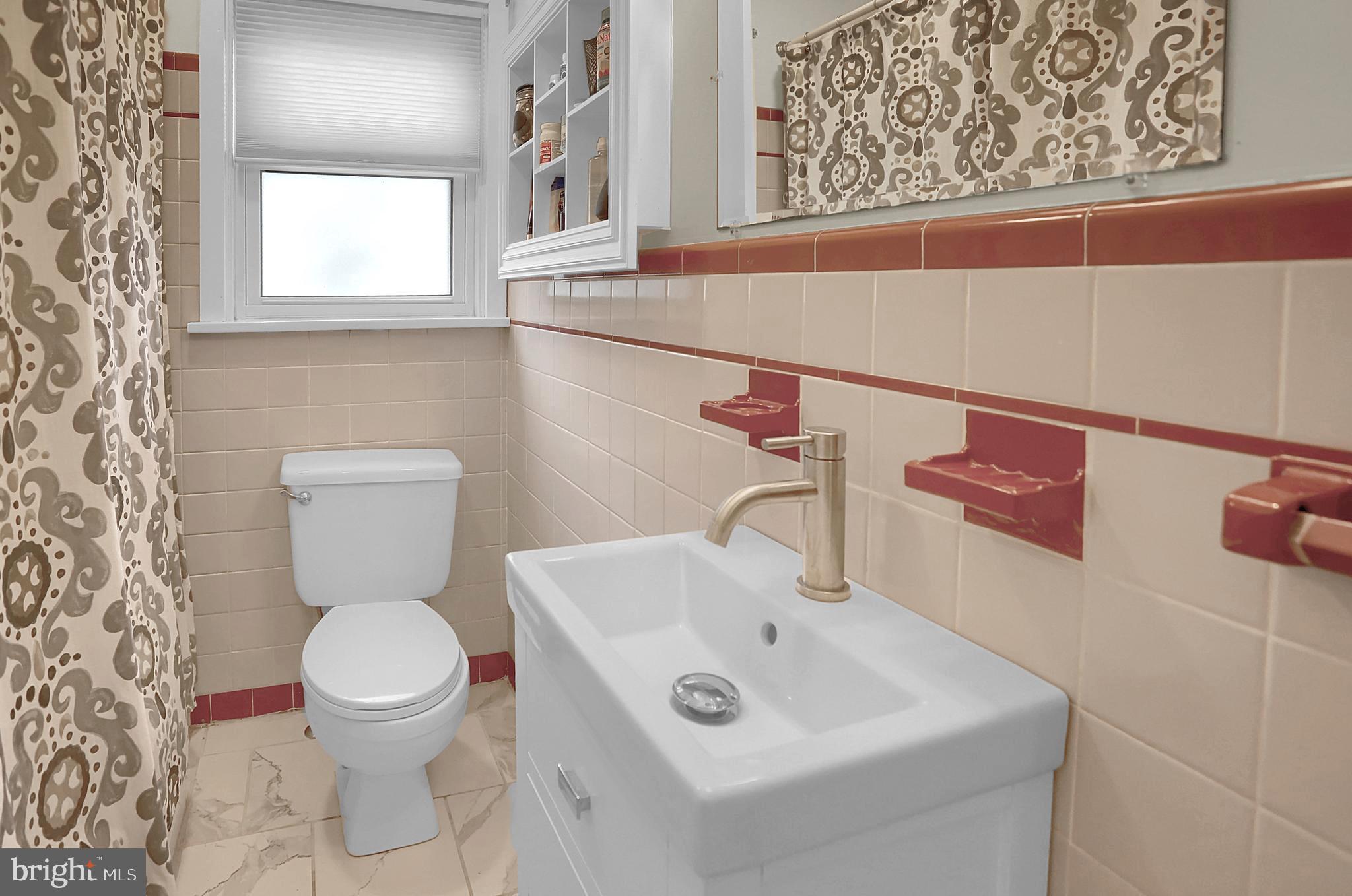 1422 Simpson Ferry Road New Cumberland, PA 17070 - Photo 23 of 35 main bath with updated floor & vanity