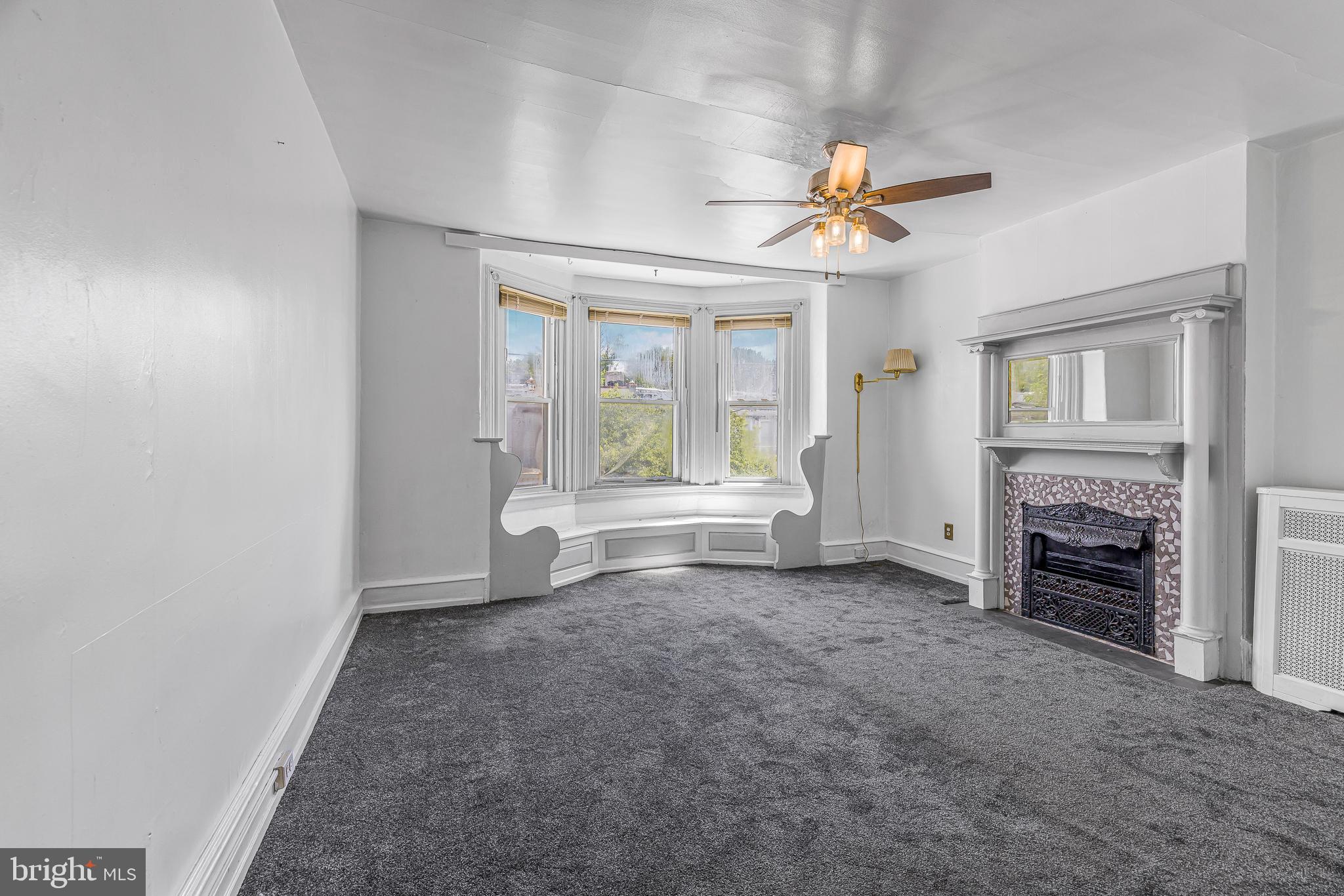 526 North 58th Street Philadelphia, PA 19131 - Photo 15 of 23 wooden floor in an empty room with a fireplace