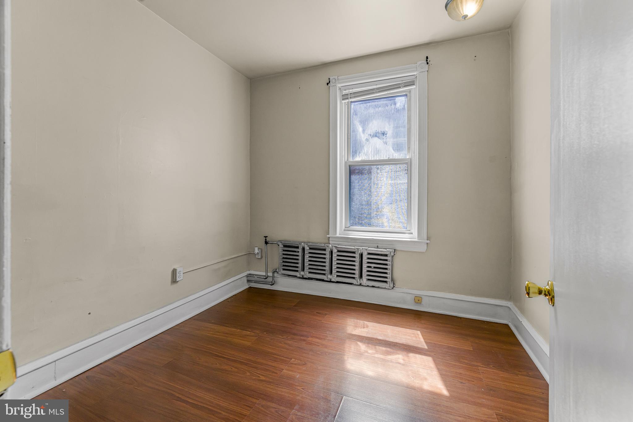 526 North 58th Street Philadelphia, PA 19131 - Photo 17 of 23 an empty room with wooden floor and windows