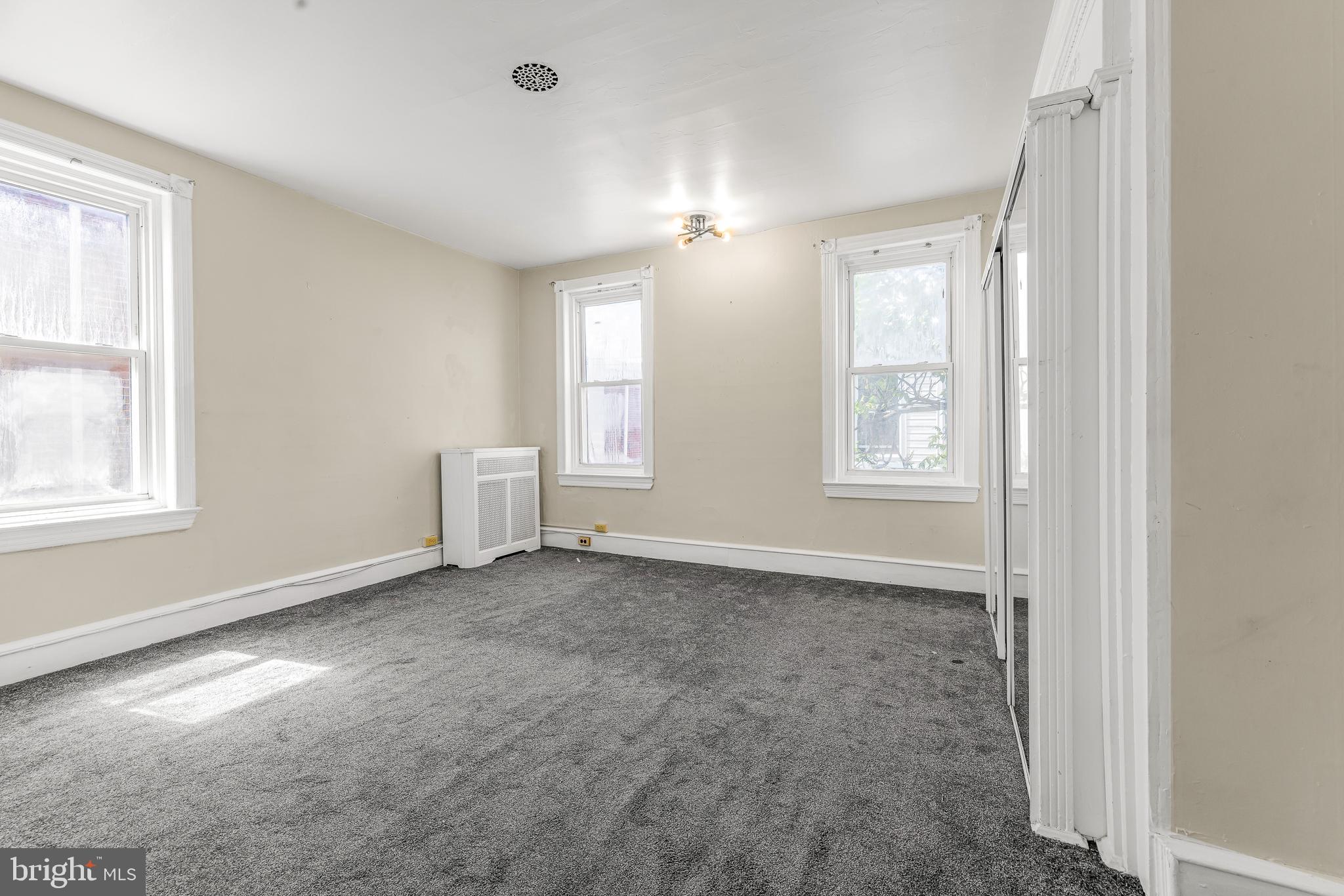 526 North 58th Street Philadelphia, PA 19131 - Photo 21 of 23 an empty room with windows and closet
