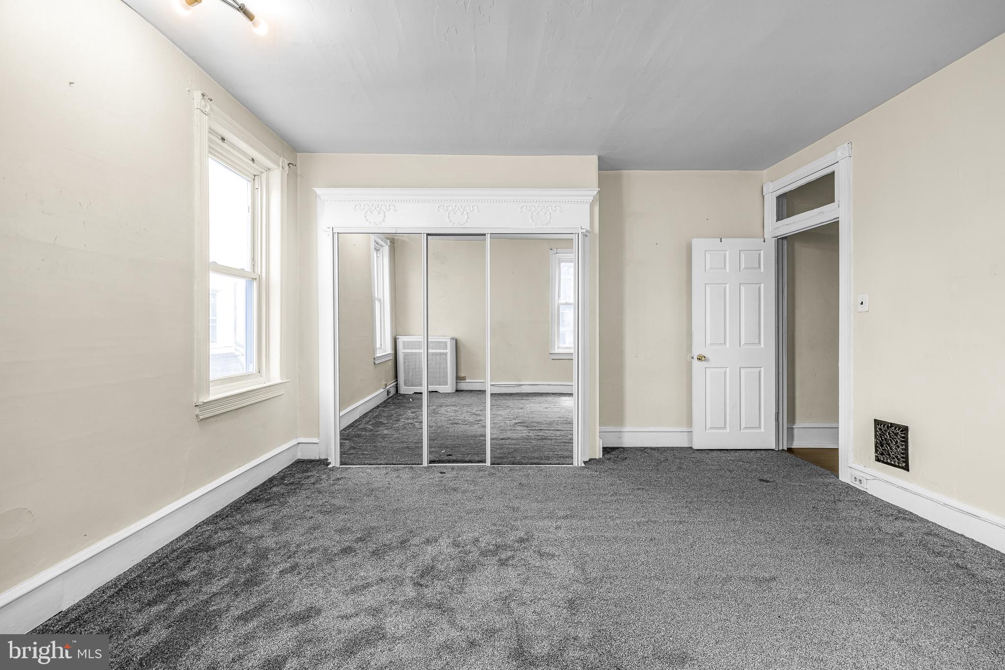 526 North 58th Street Philadelphia, PA 19131 - Photo 23 of 23 a view of an empty room with wooden floor and a window