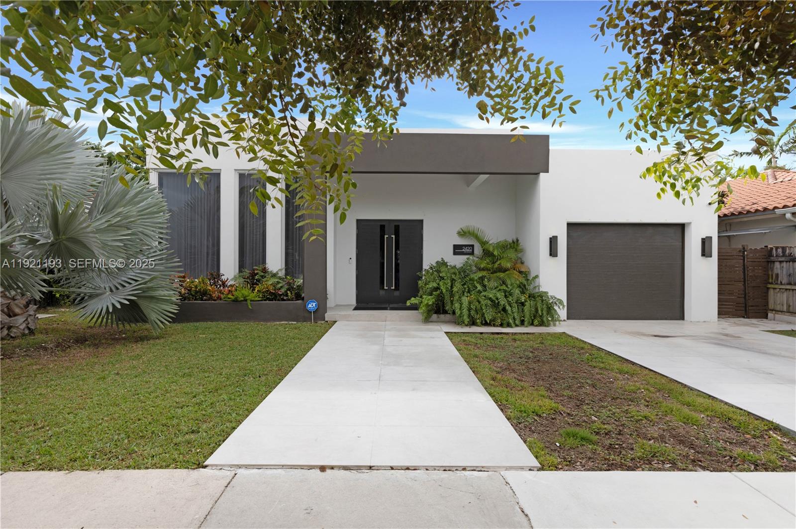 2420 Southwest 24th Street Miami, FL 33145 - Photo 2 of 53 front view of a house with a yard