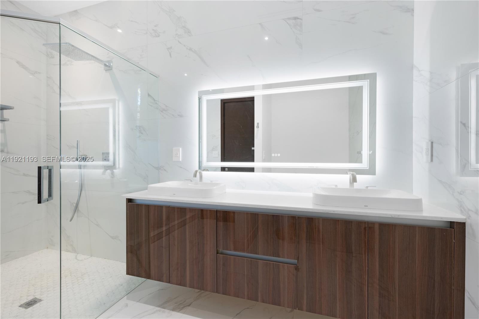 2420 Southwest 24th Street Miami, FL 33145 - Photo 38 of 53 a bathroom with a sink and a mirror