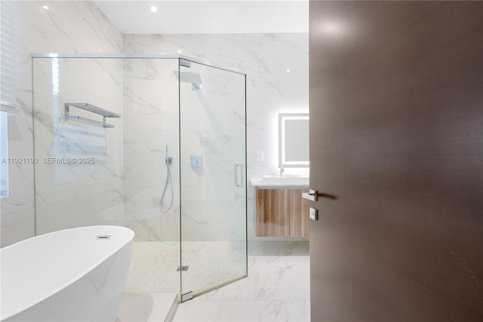 2420 Southwest 24th Street Miami, FL 33145 - Photo 39 of 53 a bathroom with a shower and a bathtub