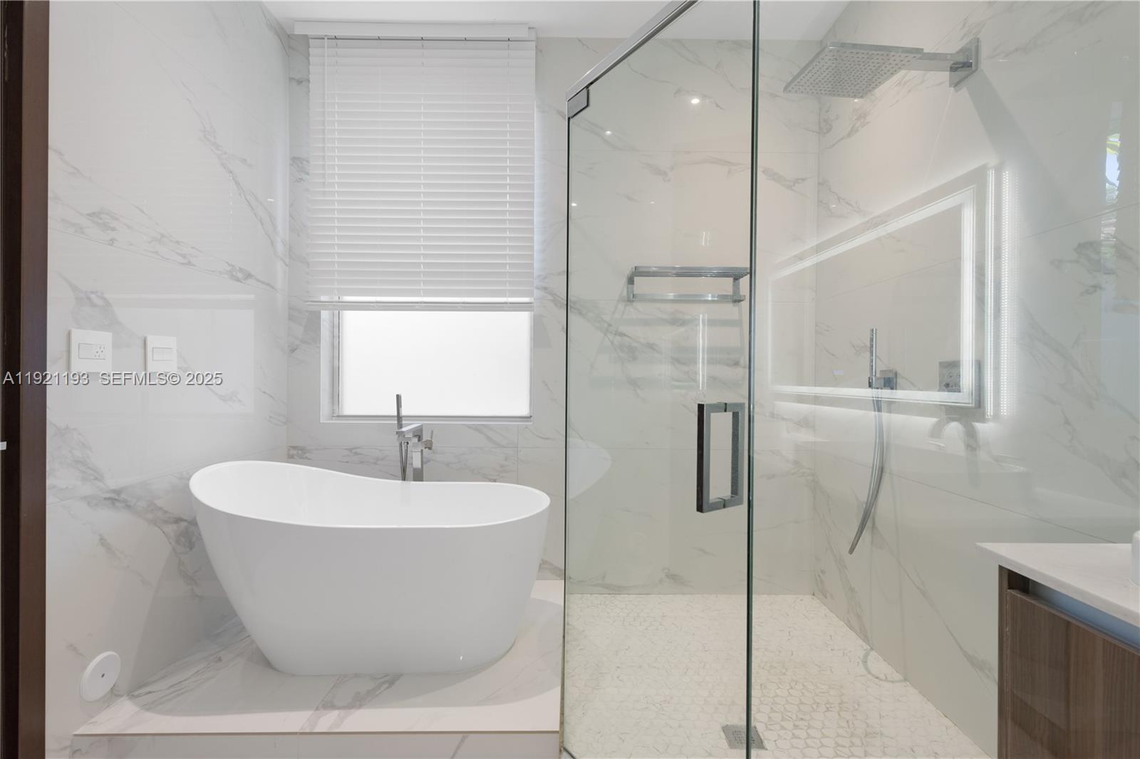 2420 Southwest 24th Street Miami, FL 33145 - Photo 40 of 53 a white bath tub sitting next to a shower