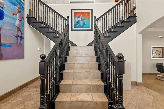 a view of entryway with wooden floor and a front door
