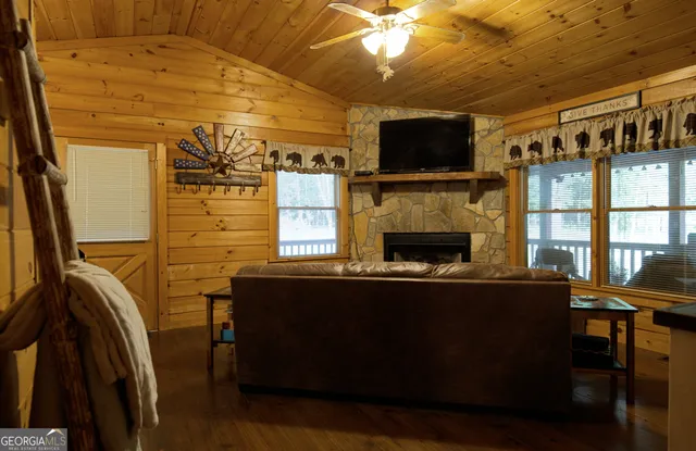 a kitchen with appliances cabinets and furniture