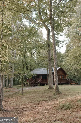 a view of a tiny house with a yard