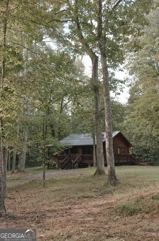 a view of a tiny house with a yard