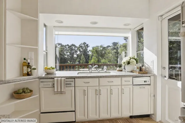 a kitchen with stainless steel appliances granite countertop a stove and a sink