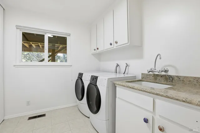 a utility room with cabinets