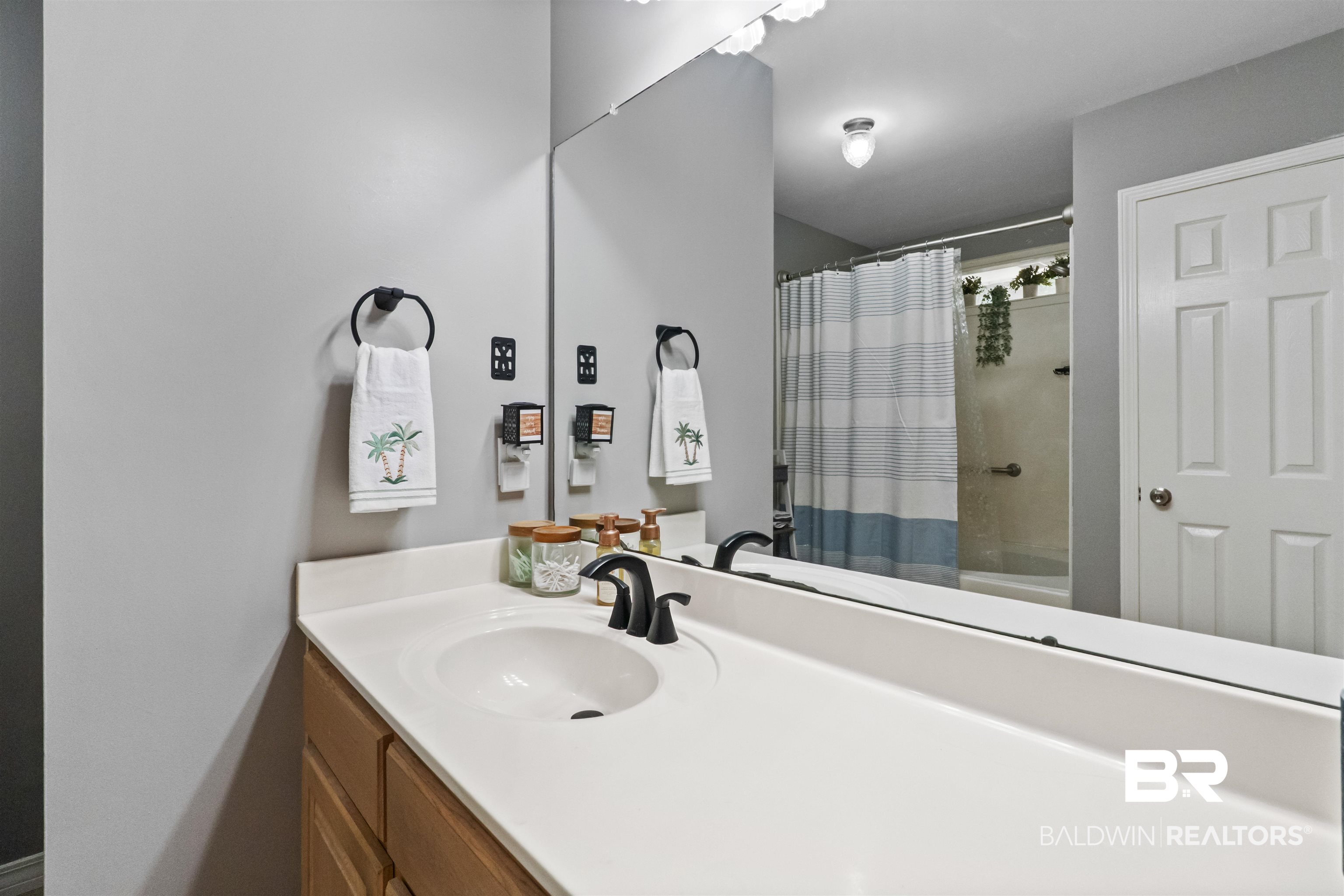 153 Lakeview Loop Daphne, AL 36526 - Photo 35 of 56 A spacious vanity and oversized mirror provide plenty of room for busy mornings and everyday routines.