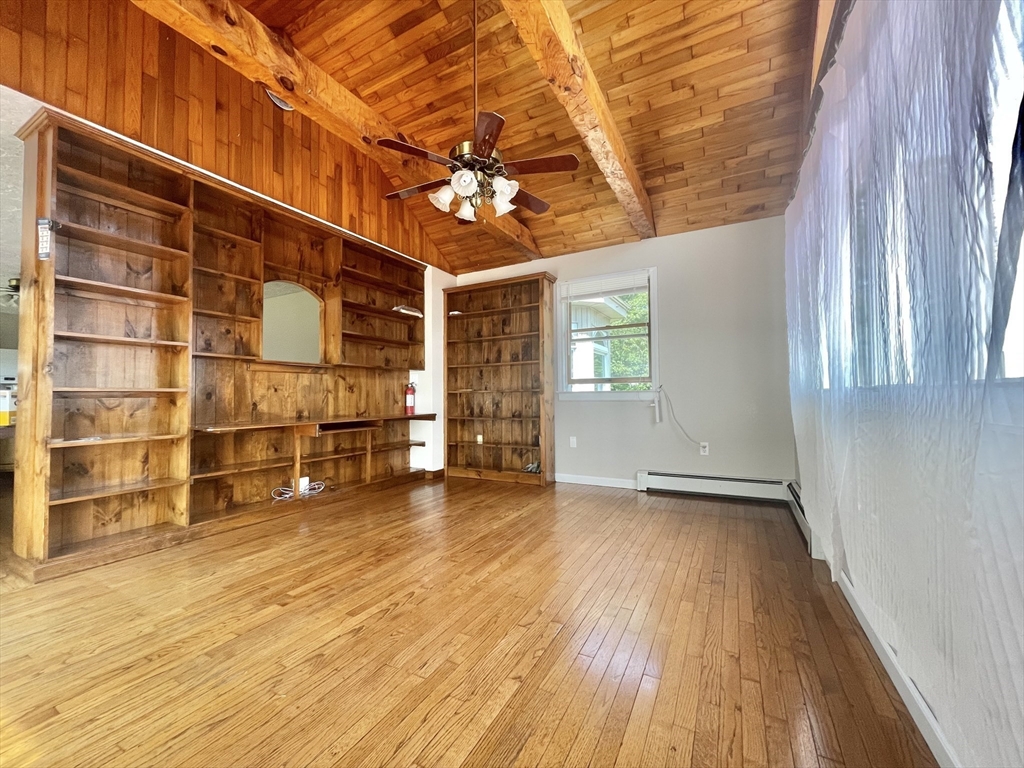 43 Tower Hill Road Brimfield, MA 01010 - Photo 18 of 36 a view of an empty room with a window and wooden floor