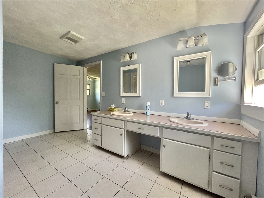 43 Tower Hill Road Brimfield, MA 01010 - Photo 20 of 36 a spacious bathroom with a double vanity sink mirror and