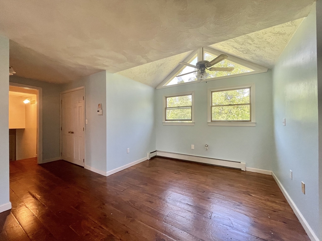 43 Tower Hill Road Brimfield, MA 01010 - Photo 23 of 36 an empty room with wooden floor and windows