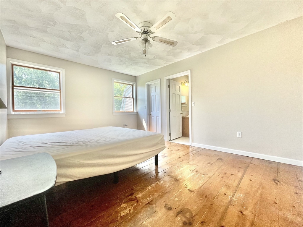43 Tower Hill Road Brimfield, MA 01010 - Photo 24 of 36 a bedroom with a bed and a chandelier